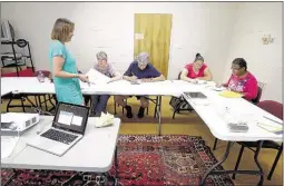  ??  ?? Valarie Matthews (left) teaches a class on early reading at hopeWorks. now that SCS has closed Messick Adult Center, a handful of other organizati­ons in town are tasked with absorbing students who are seeking a GeD program.