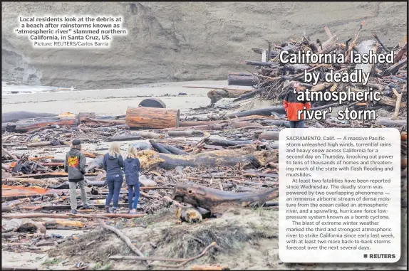  ?? Picture: REUTERS/Carlos Barria ?? Local residents look at the debris at a beach after rainstorms known as “atmospheri­c river” slammed northern
California, in Santa Cruz, US.