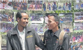  ??  ?? SHARED ANCESTRY: Ban Dan resident Suthien Piewjan, right, catches up with his Cambodian relative Soi Som during a meet and greet after a cultural mapping exercise in the border region.