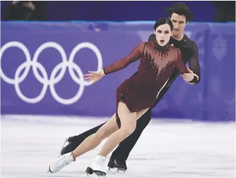  ?? - La Presse canadienne ?? Tessa Virtue et Scott Moir ont exécuté un programme de quatre minutes sans faute.