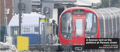  ?? PHOTO: STEFAN ROUSSEAU/PA WIRE ?? A forensic tent on the platform at Parsons Green