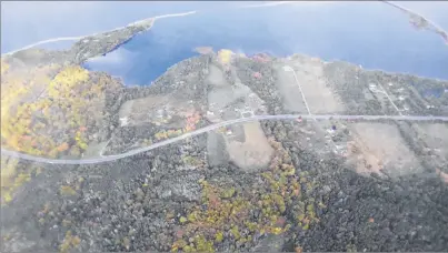  ?? SUBMITTED PHOTO ?? This aerial view of Big Pond Centre shows the “barachois” or coastal lagoon that defines the area. A 541-site RV park and campground are proposed for a 109-acre parcel of land that includes about 1,000 feet of shoreline located just left of the cleared...