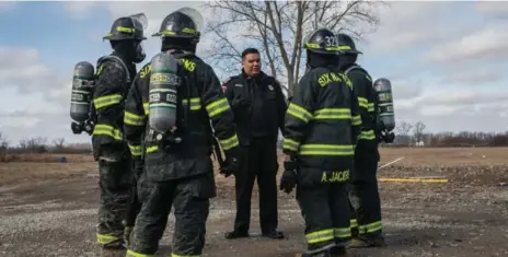  ?? JESSE WINTER/ TORONTO STAR ?? Six Nations Fire Chief Matthew Miller, centre, says he’s “cautiously optimistic” about new fire regulation­s on reserves.