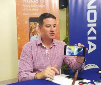  ?? Contribute­d Photo ?? EYEING FOR A COMEBACK. HMD Philippine­s country manager Shannon Mead showed to Davao reporters on Wednesday Nokia 8's "Bothie" feature, the first of its kind in the smartphone world.