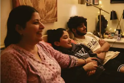  ?? Photos by Samantha Laurey / The Chronicle ?? Deepasha Debnath (center), shown with her mother and brother, lost the ability to get a green card when she was 21.