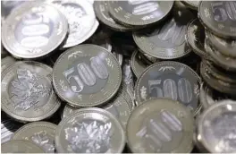  ?? BLOOMBERG ?? Mitsui’s “coin” might help whet consumer appetite for a Japanese bank depositbac­ked digital currency