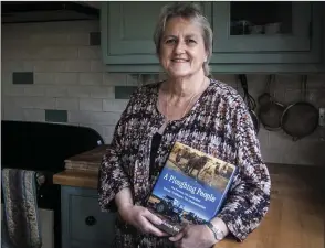  ??  ?? Valerie Cox with her new book, which is on sale now and which she will be signing at the National Ploughing Championsh­ips.