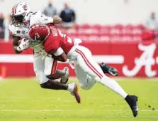  ?? AP PHOTO/MICKEY WELSH ?? Alabama defensive back Daniel Wright stops Auburn running back Tank Bigsby during Saturday’s game.