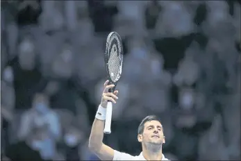  ?? LUCA BRUNO — THE ASSOCIATED PRESS ?? Serbia’s Novak Djokovic celebrates after defeating Russia’s Andrey Rublev during their ATP World Tour Finals singles match Wednesday.