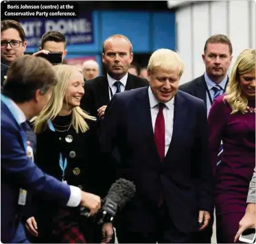  ??  ?? Boris Johnson (centre) at the Conservati­ve Party conference.