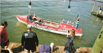  ?? STEPHEN M. KATZ/STAFF ?? To the cheers of supporters, Peter Harley leaves Dockside in Virginia Beach on Sunday to begin his solo row across the Atlantic Ocean to France.