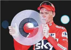  ?? AP ?? Britain’s Chris Froome celebrates on podium after winning the Spanish Vuelta in Madrid on Sunday.