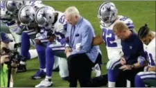  ?? ASSOCIATED PRESS ?? The Dallas Cowboys, led by owner Jerry Jones, center, take a knee prior to the National Anthem prior to Monday night’s game against the Arizona Cardinals.