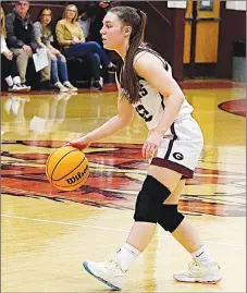  ?? Westside Eagle Observer/RANDY MOLL ?? Gentry junior Emma Tevebaugh dribbles the ball downcourt during play against Prairie Grove at Gentry High School on Dec. 20.