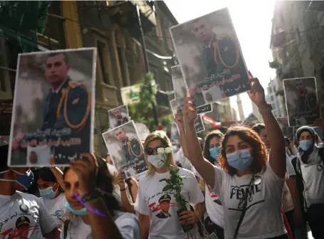  ?? Reuters ?? Relatives take part in a vigil yesterday for victims of last week’s deadly explosion in Beirut