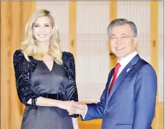  ??  ?? Moon shakes hands with Ivanka during their dinner at the Presidenti­al Blue House in Seoul, South Korea. — Reuters photo