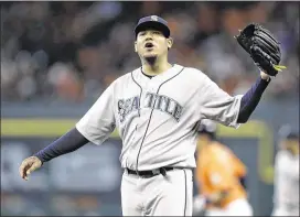  ?? AP ?? Mariners ace Felix Hernandez allowed eight runs on five hits and two walks in one-third of an inning in Houston’s 10-0 victory Friday. The outing tied the shortest of his career.