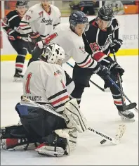  ?? T.J. COLELLO/CAPE BRETON POST ?? From left, Pictou County Scotians goaltender Brandon MacDonald makes a save while Scotians defender Ryan Dunfield ties up Kelly Yates of the Kameron Junior Miners during Game 7 of the Sid Rowe Division championsh­ip on Sunday at the Membertou Sport and...