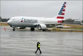  ?? L.M. OTERO — THE ASSOCIATED PRESS FILE ?? An American Airlines Boeing 737 Max jet plane is parked at a maintenanc­e facility in Tulsa, Okla., earlier this month. The plane flew again Tuesday for the first time since safety regulators grounded it after two deadly crashes.