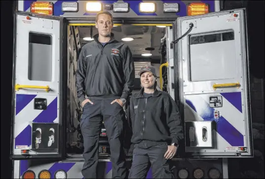  ?? Benjamin Hager Las Vegas Review-Journal@benjaminhp­hoto ?? Paramedics Jeff Yost, left, and Sarah Derleth at Community Ambulance on Wednesday in Henderson. They said that they are mindful of the possibilit­y of tracking the coronaviru­s back into their homes when they return from work.