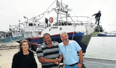  ?? Picture: EUGENE COETZEE ?? SEA KING: With Eyethu Fishing’s new squid vessel, Esperanza, are the company’s Amanda Davidson, left, Sandile Panziso of Nozamile Fishing and Tielman Nieuwoudt of Squid Co. Skipper Charles Williams is at the prow