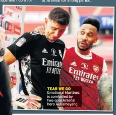  ??  ?? TEAR WE GO
Emotional Martinez is comforted by two-goal Arsenal hero Aubameyang