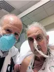  ?? ?? SURGEON Dr Bartley Griffith with his late patient David Bennett sr, who received a heart implant from a geneticall­y modified pig. | AFP
