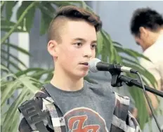  ?? JOHN CAVANAUGH/SPECIAL TO POSTMEDIA NEWS ?? Evan Rotella, 12, opens up for Marty Allen and his Man in Black show Saturday at the Niagara Falls Optimist Club.