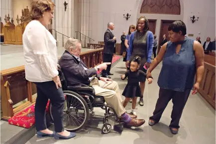  ?? Mark Burns/Office of George H.W. Bush/Pool via AP ?? ■ Former President George H.W. Bush greets the mourners with his daughter Dorothy “Doro” Bush Koch on Friday during the visitation for former first lady Barbara Bush at St. Martin’s Episcopal Church in Houston. Barbara Bush died Tuesday at age 92.