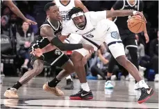  ?? ?? Memphis Grizzlies’ Vince Williams Jr. (5) protects the ball from Brooklyn Nets’ Dennis Schroder on Monday during an NBA basketball game in New York. (AP photo/frank Franklin II)