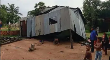  ?? SUPPLIED ?? A semi-collapsed house barely stands in Kandal province after being battered by stormy weather.