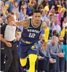  ?? BRANDON DILL/ASSOCIATED PRESS ?? Grizzlies guard Ja Morant reacts after scoring during Game 2 of a second-round playoff series against the Golden State Warriors on Tuesday in Memphis, Tenn.