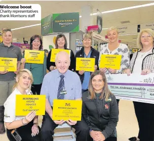  ??  ?? Welcome boost Charity representa­tives thank Morrisons staff