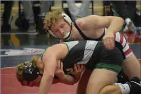  ?? ?? Duke Myers of Bellmont takes control of his match against Landon Bradnick of Yorktown on Thursday, January 11, 2024 in Decatur.