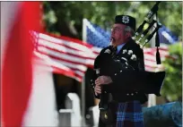  ?? ?? Bagpiper Charlie Miller playing ‘Amazing Grace.’