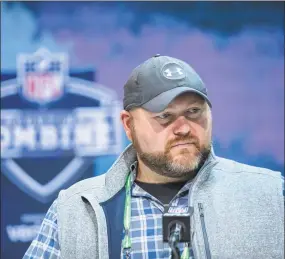  ?? Michael Hickey / Getty Images ?? Jets general manager Joe Douglas speaks to the media at February’s NFL Combine.