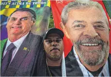  ?? FOTO: ERNESTO BENAVIDES/AFP ?? Herausford­erer Lula (Plakat rechts) liegt in Umfragen vor Amtsinhabe­r Bolsonaro (links).