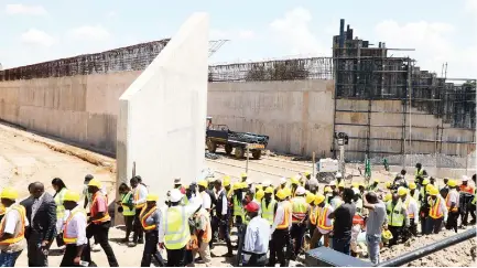  ?? ?? Government officials, contractor­s and journalist­s tour Mbudzi Interchang­e project in Harare yesterday. The project is now more than 50 percent complete