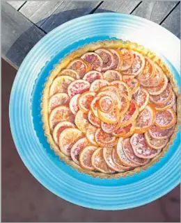 ?? Photograph­s by Myung J. Chun Los Angeles Times ?? A BLOOD ORANGE and rhubarb tart is a delightful mix of sweet and tart. Leave the skin on the oranges so that they soften and sweeten in the syrup.