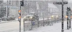  ??  ?? It’s a whiteout Hamilton town centre during last week’s heavy snowfall