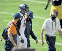  ?? Andy Cross, The Denver Post ?? Denver wide receiver Courtland Sutton comes off the field with help from trainers in the second quarter against Pittsburgh at Heinz Field on Sunday.