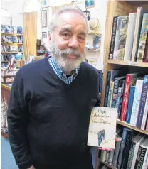  ?? PHOTO: ASHLEY SMYTH ?? Eddie stuff . . . Adventure Books owner Bill Nye holds a first edition of Sir Edmund Hillary’s first book on the ascent of Everest, available at his store.