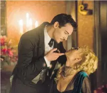  ?? NBC ?? Jonathan Rhys Meyers, left, strikes a familiar pose as Alexander Grayson, a.k.a. Dracula, with Victoria Smurfit as Lady Jayne Wetherby