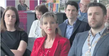  ??  ?? Martina Anderson (centre) at Tullycarne­t Library. Below: arriving at the venue