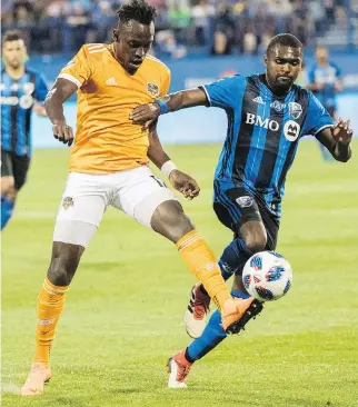  ?? GRAHAM HUGHES/THE CANADIAN PRESS ?? The Impact’s Chris Duvall, here fighting Houston Dynamo’s Alberth Elis for possession, is firmly behind underdog Croatia in the World Cup final.