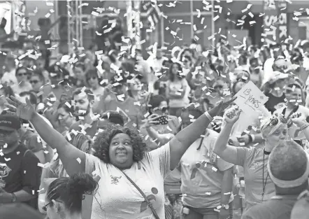  ?? FRED SQUILLANTE/COLUMBUS DISPATCH ?? Candice Hicks of Columbus poses for pictures at the start of the 27th annual Komen Columbus Race for the Cure in 2019. This year’s event will take place Saturday.