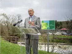  ?? Alexandra Wimley/Post-Gazette ?? Dr. Allan Klapper, president of AHN Wexford Hospital, speaks during a news conference to unveil signs marking stops on the new ecotherapy trail at North Park.