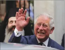  ?? Associated Press photo ?? In this May 10 file photo, Britain’s Prince Charles, waves as he leaves a meeting with the head of Greece's Orthodox Church Archbishop Ieronymos, in Athens. Kensington Palace announced on Friday Prince Charles will walk Meghan Markle down the aisle in...