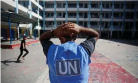  ?? Photograph: Mohammed Faiq/AFP/Getty Images ?? A UN worker pictured in the yard of a UN-run school in Gaza. Unrwa has provided vital support to Palestinia­ns for decades and has previously been accused by Israel of collaborat­ing with Hamas.