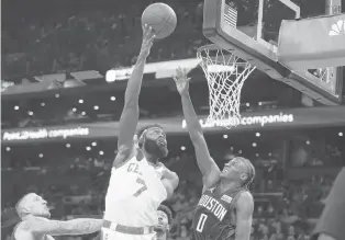  ?? CHARLES KRUPA | AP ?? Celtics guard Jaylen Brown shoots over the Rockets’ Jalen Green Monday in Boston. Brown returned after missing eight games with a hamstring injury.